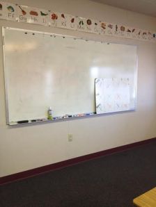 My whiteboard... I usually use the tiny one to display which group is doing what activity each rotation. There are four groups: Red, Orange, Green, and Blue, each at different reading levels.